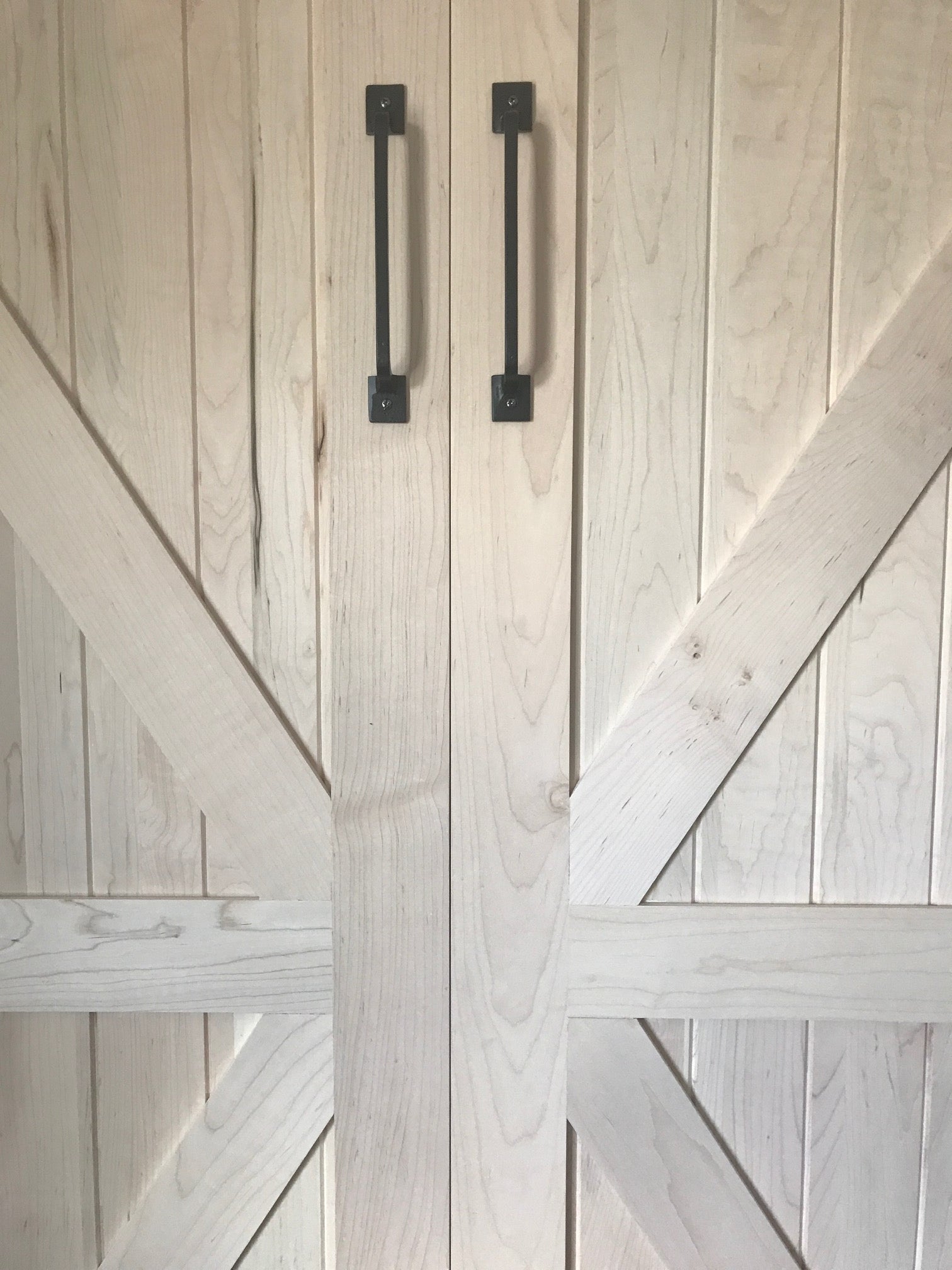 The Barn Door Panel Bed A in color white, front view with handle